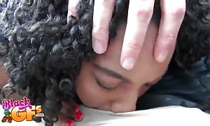 Curly-hair black
 swallowing his tasty prick
 with closed eyes