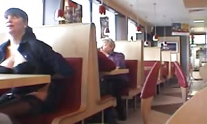 huge-boobed stunner flashing in a restaurant