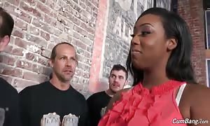 Big-breasted ebony slut staying on her knees and deepthroating white hard-ons