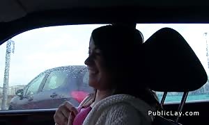 dark haired newcummer beauty bangs in vehicle
 in public